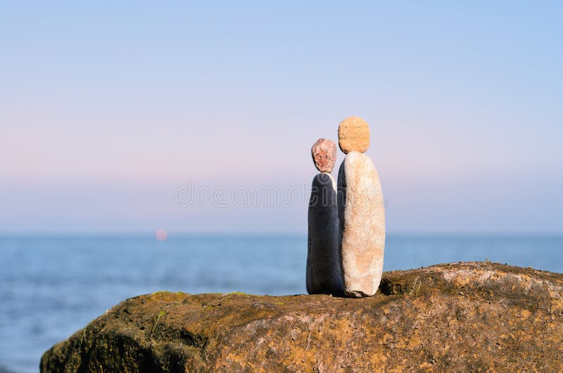 Figurines of man and woman stock image. Image of pyramidal - 49430743