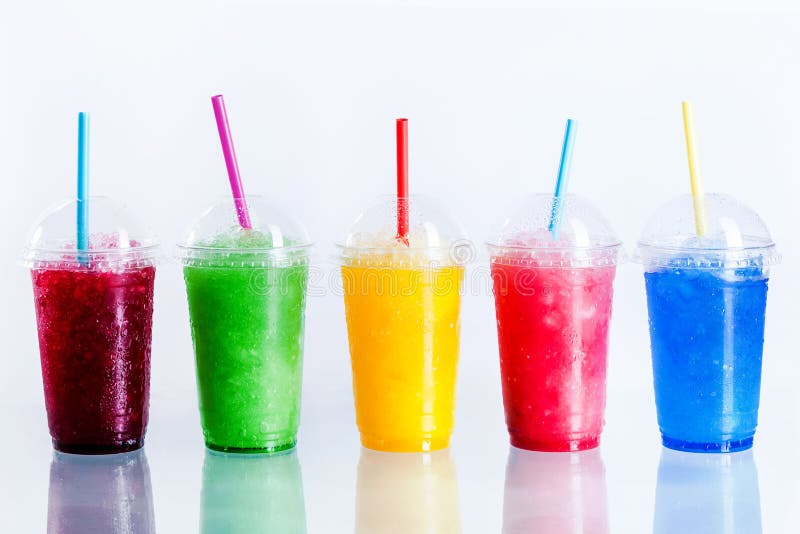 Panoramic Still Life of Colorful Frozen Fruit Slush Granita Drinks in Plastic Take-Away Cups with Lids and Drinking Straws in front of White Background. Panoramic Still Life of Colorful Frozen Fruit Slush Granita Drinks in Plastic Take-Away Cups with Lids and Drinking Straws in front of White Background