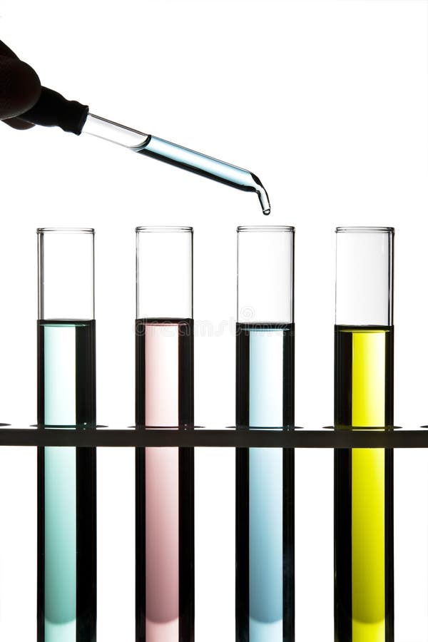 Row of test tubes filled with colored fluid. Row of test tubes filled with colored fluid