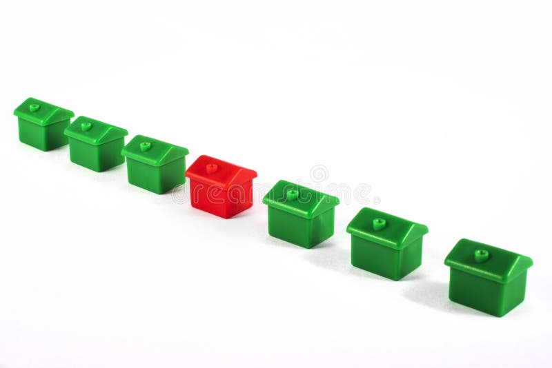 A row of toy houses over a plain white background. A row of toy houses over a plain white background.