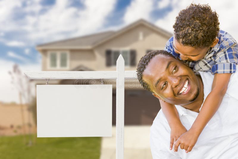 Happy African American Father and Mixed Race Son In Front of Blank Real Estate Sign and New House. Happy African American Father and Mixed Race Son In Front of Blank Real Estate Sign and New House.