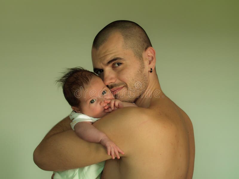 Newborn baby, young father holding his little son, new life, beautiful baby boy in fathers arms, love and fatherhood. Newborn baby, young father holding his little son, new life, beautiful baby boy in fathers arms, love and fatherhood