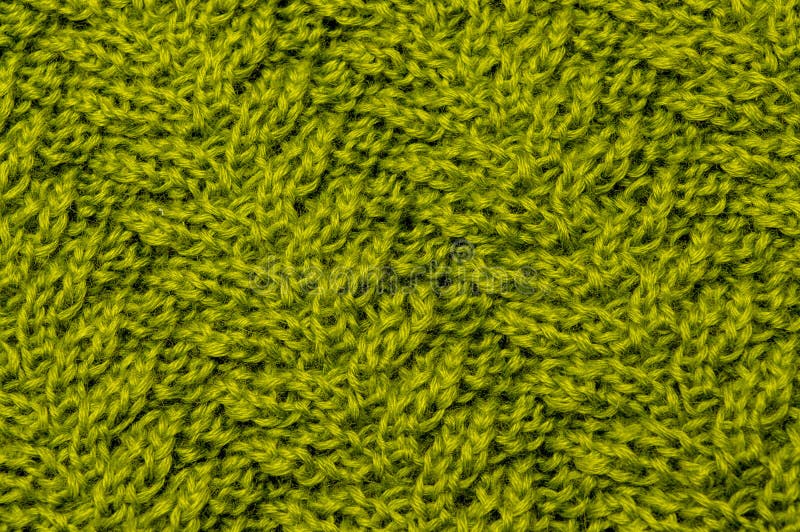 Fili verde oliva della lana dell'oro verde in tessuto tricottato immagine stock Fili verde oliva della lana dell'oro verde in tessuto tricottato immagine stock