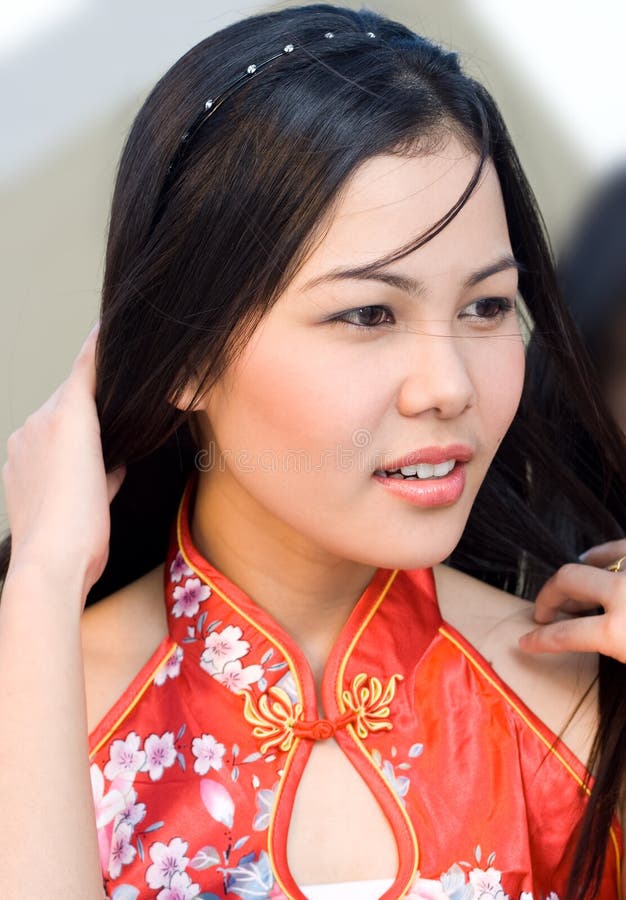 A beautiful Filipina wearing chinese dress.