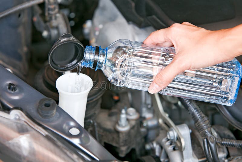 Fill the Windshield Water Liquid on a Car. Stock Photo Image of