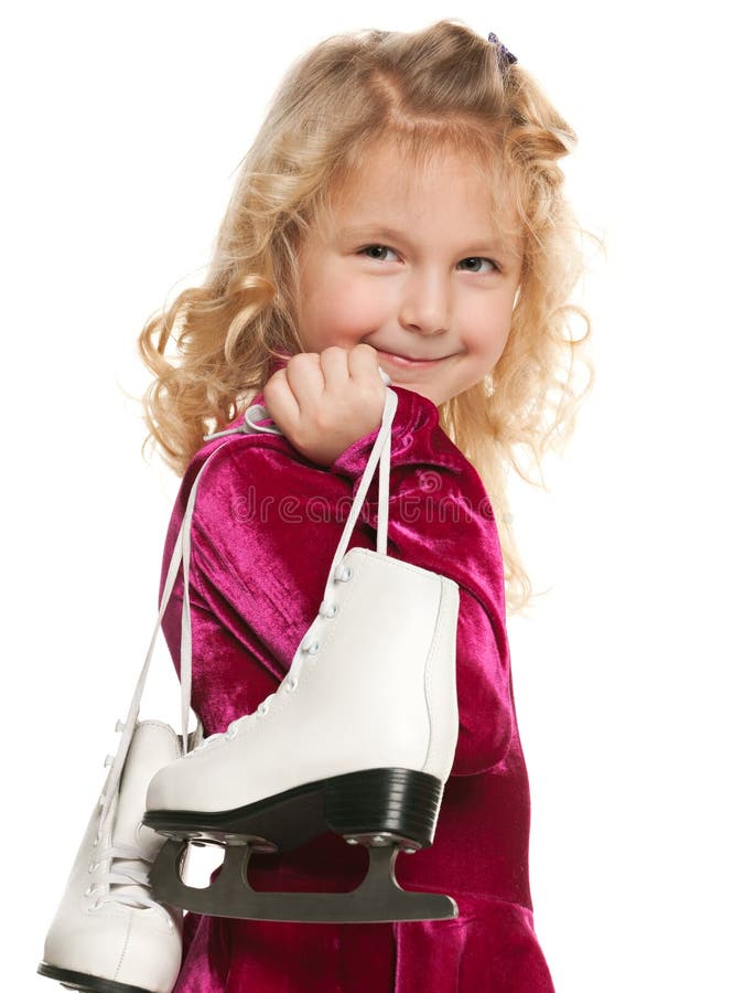 Fille assez petite avec des patins photographie stock libre de droits Fille assez petite avec des patins photographie stock libre de droits