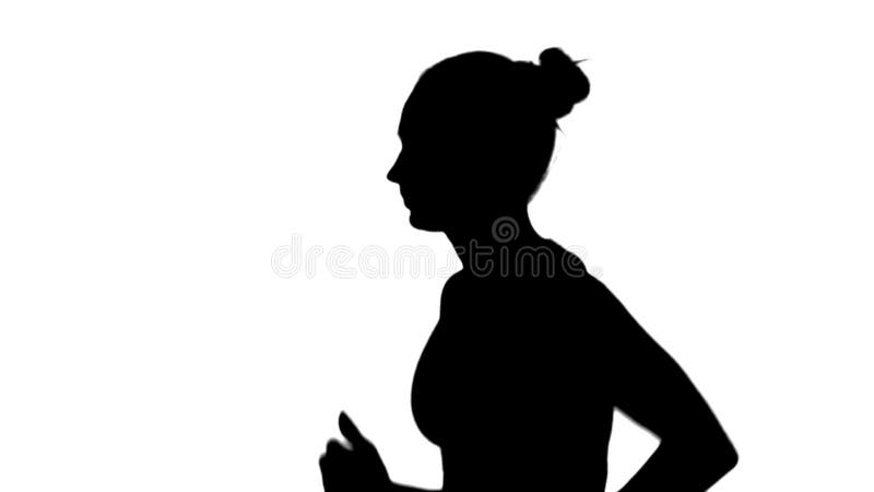 Fille avec le fonctionnement sportif de corps Vue de côté Silhouette blanc Mouvement lent banque de vidéos