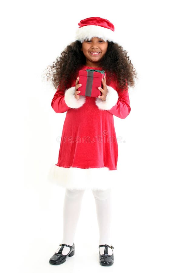 Beautiful five year old African American girl in Christmas dress and hat. Beautiful five year old African American girl in Christmas dress and hat.