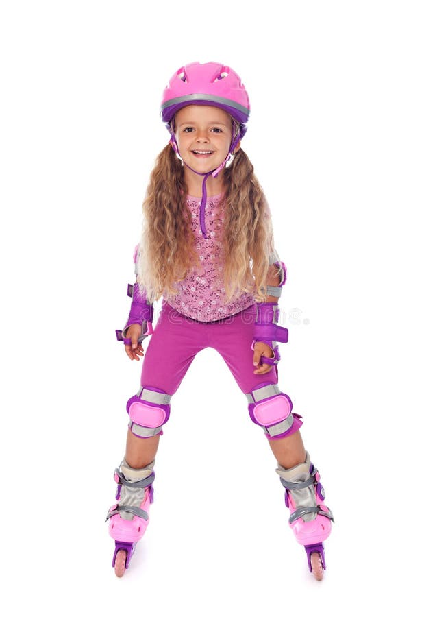Fille de patinage de rouleau petite riant - d'isolement photographie stock libre de droits Fille de patinage de rouleau petite riant - d'isolement photographie stock libre de droits
