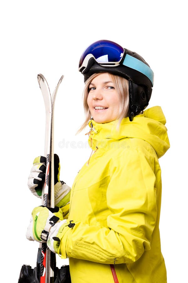 Fille de sourire dans le casque tenant des skis images stock Fille de sourire dans le casque tenant des skis images stock