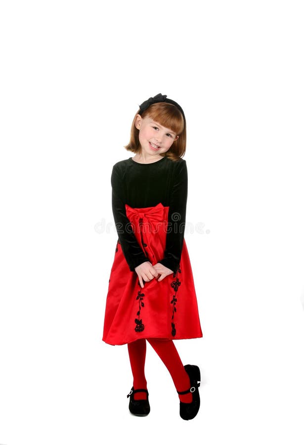 Fille mignonne dans la robe rouge de vacances photos stock Fille mignonne dans la robe rouge de vacances photos stock