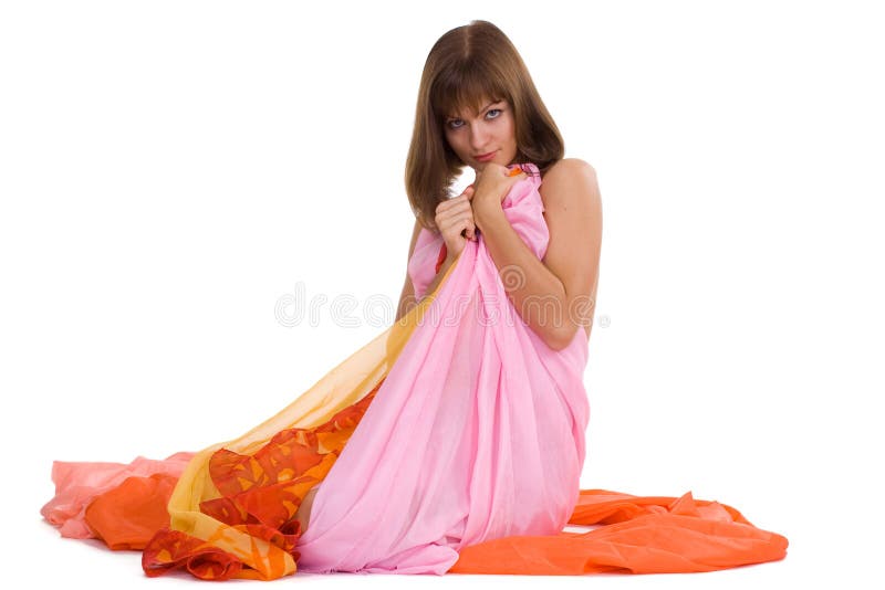 Naked girl in the color tissue on white background. Sit. Naked girl in the color tissue on white background. Sit.