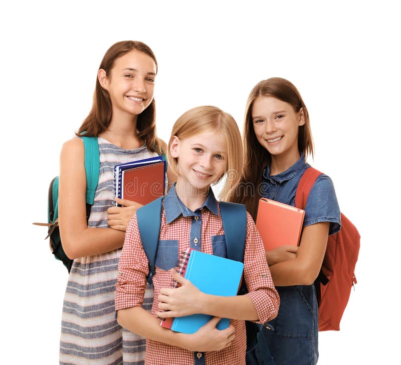 Filles mignonnes d'adolescent tenant des carnets, d'isolement sur le blanc image libre de droits Filles mignonnes d'adolescent tenant des carnets, d'isolement sur le blanc image libre de droits