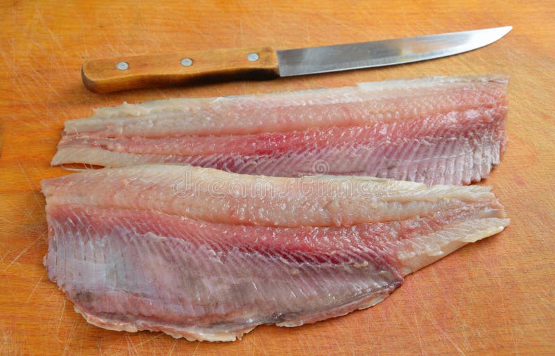 Fillet Of Herring On A Plate And Baked In The Oven Potatoes. Delicious Traditional Food Of