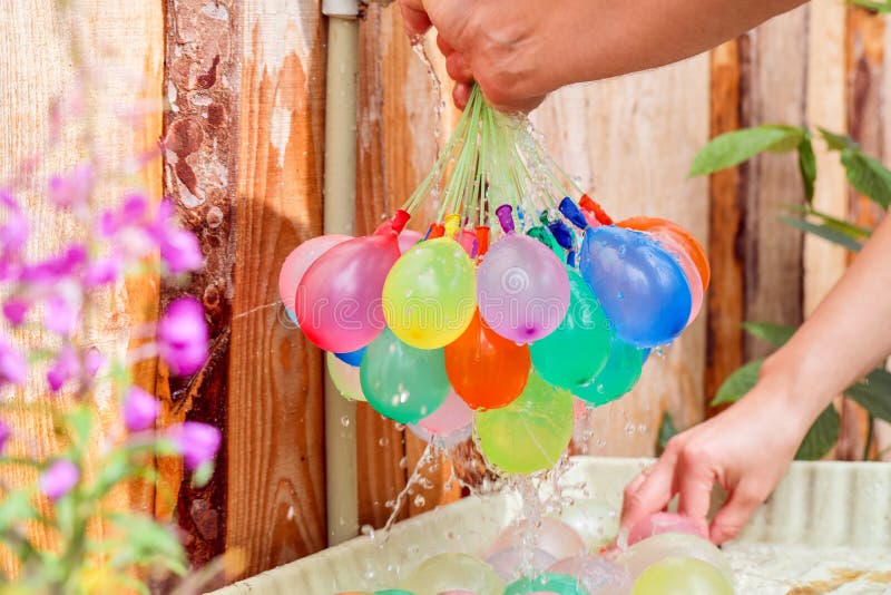 Water balloons stock image. Image of kids, rainbow, water 55878957