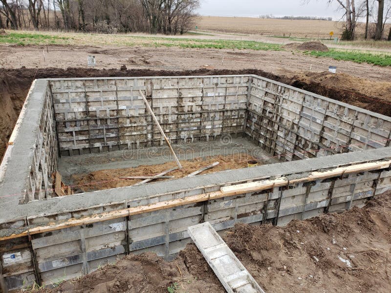New Construction. Pouring the Concrete Walls of a Basement. Stock Image