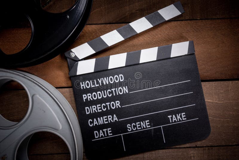 https://thumbs.dreamstime.com/b/film-reel-clapboard-hollywood-entertainment-industry-background-wood-table-multiple-reels-wooden-objects-146986236.jpg