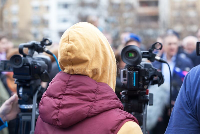 Filming An Event With A Video Camera. Press Conference. Stock Photo Image of headlines