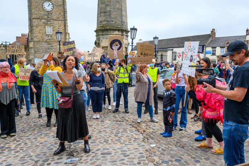 Filming a speaker at a Black Lives Matter protest on the cobbles of The Marketplace in Richmond, North Yorkshire stock image Filming a speaker at a Black Lives Matter protest on the cobbles of The Marketplace in Richmond, North Yorkshire stock image