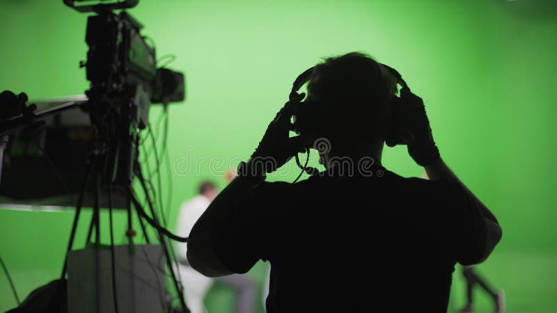 Filmploeg in groene studio