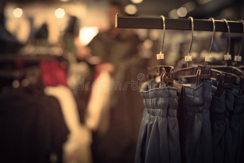 Filtered image shallow dof image clothes hanging at clothes store in America stock photography Filtered image shallow dof image clothes hanging at clothes store in America stock photography