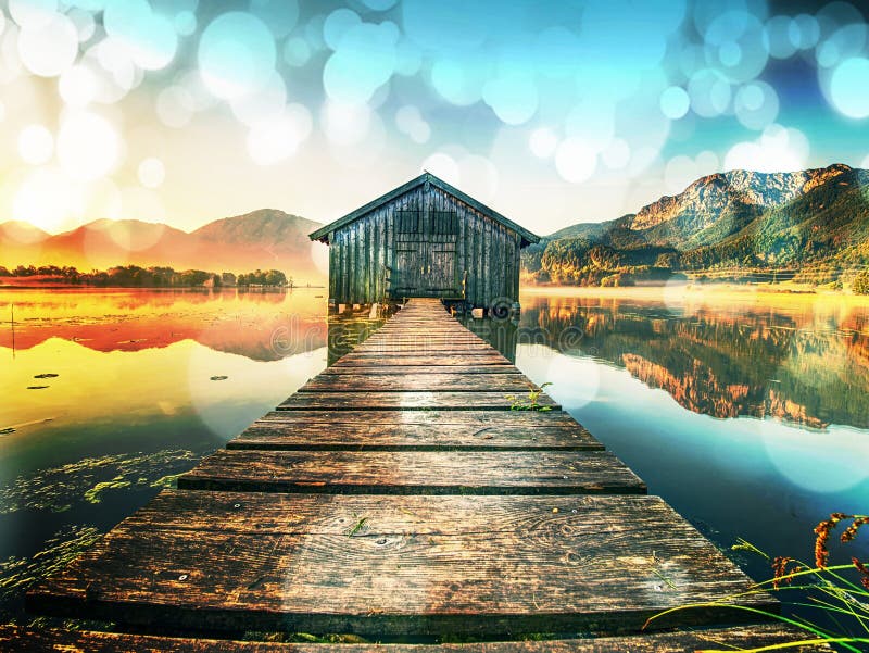 Filtered. Old wooden ship house at scenic Lake. Silent bay. Abstract., over filtered. Old wooden ship house at scenic Lake. Silent bay of famous mountain ake royalty free stock photos Filtered. Old wooden ship house at scenic Lake. Silent bay. Abstract., over filtered. Old wooden ship house at scenic Lake. Silent bay of famous mountain ake royalty free stock photos