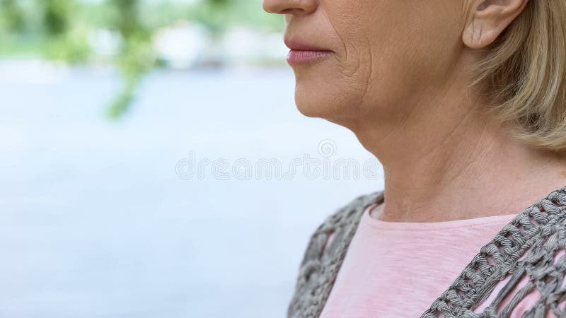 Wrinkled old woman close up, thyroid gland illness, medical examination, health, stock photo. Wrinkled old woman close up, thyroid gland illness, medical examination, health, stock photo
