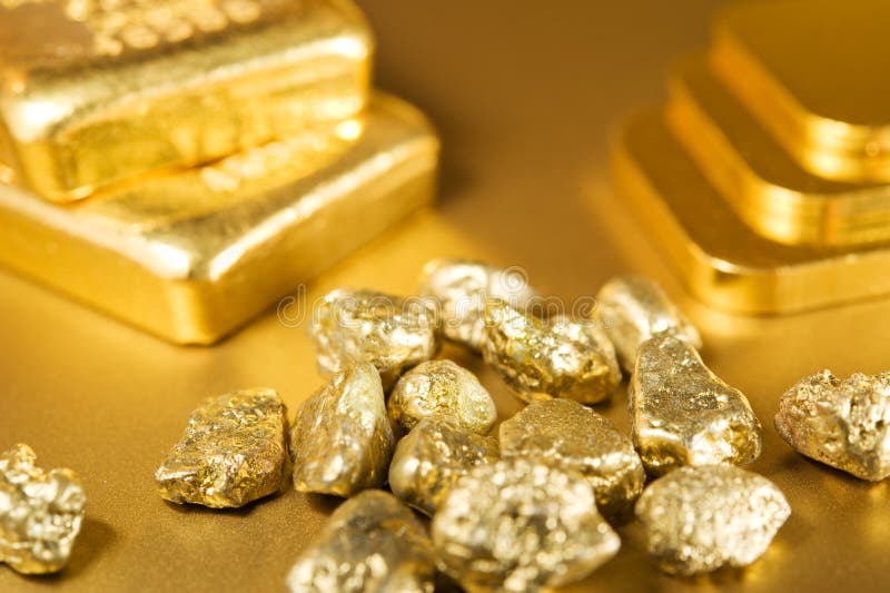 Fine gold ingots and nuggets. Fine gold ingots and nuggets.