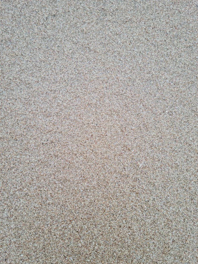 Fin textur av grov sand på stranden arkivbild