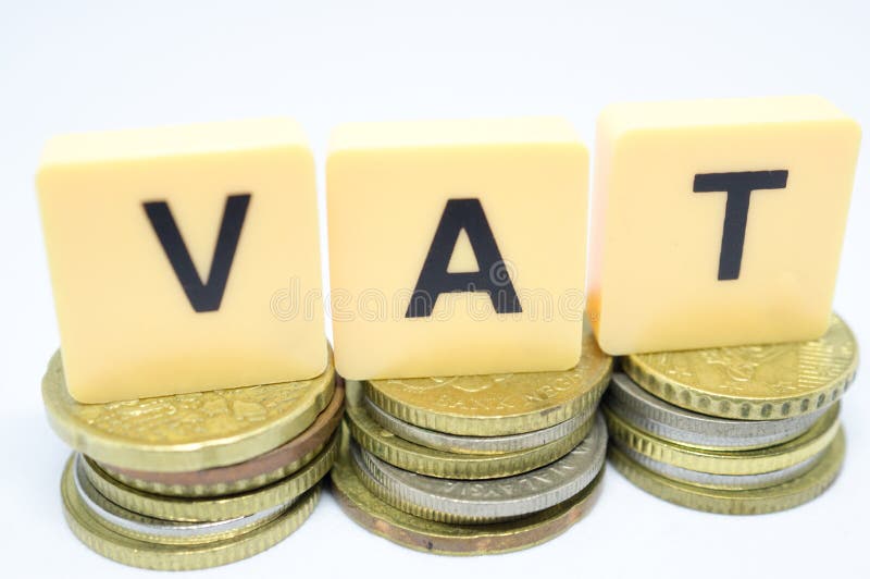 Finance Concept with Stack of Coins VAT Value Added Tax Written on