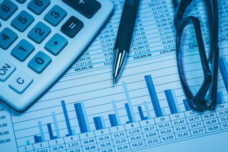 Finance, financial analysis, accounting accounts spreadsheet with pen glasses and calculator in blue. Close up concept for stock, stock photo Finance, financial analysis, accounting accounts spreadsheet with pen glasses and calculator in blue. Close up concept for stock, stock photo