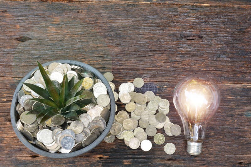 Finance, success, growth, light bulb stack coin and flower pot p royalty free stock photography