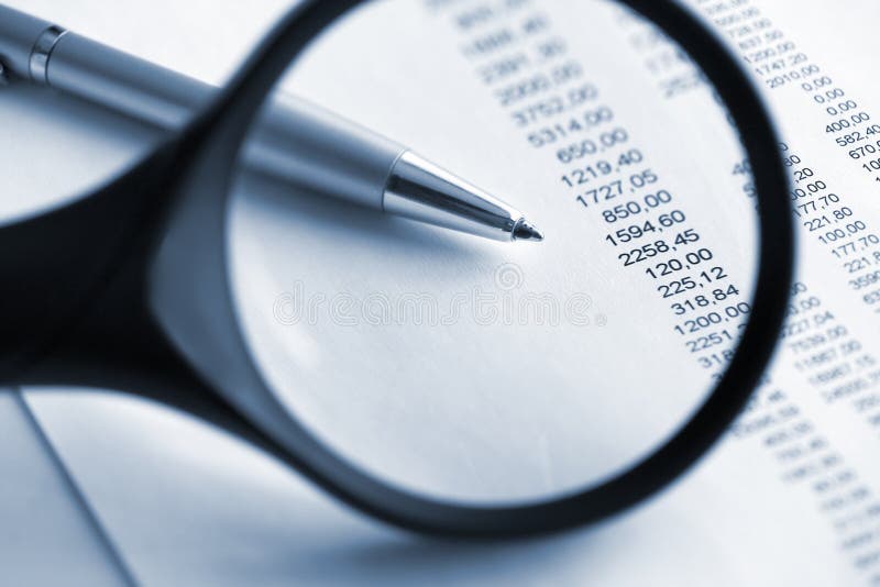 Financial analyze with magnifying glass