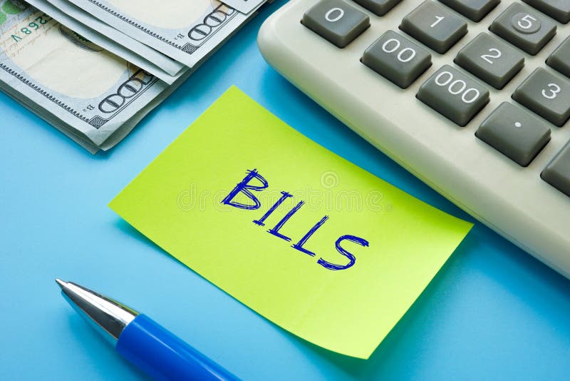 financial-concept-meaning-bills-with-sign-on-the-sheet-stock