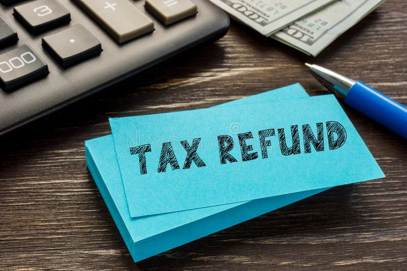 financial-concept-meaning-tax-refund-with-sign-on-the-sheet-stock-photo