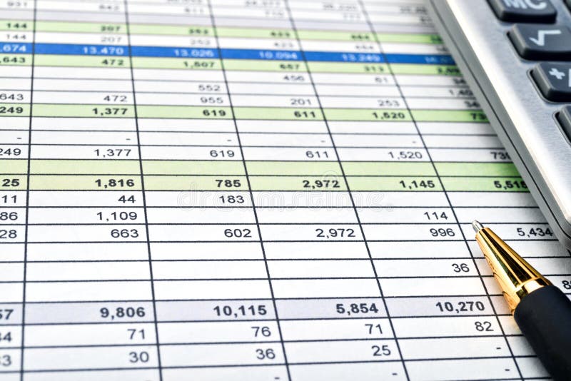 Financial forms with pen and calculator.