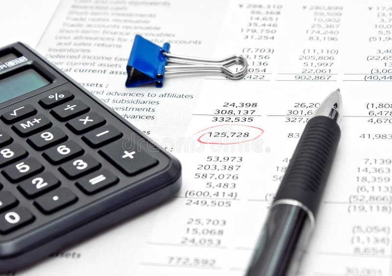 Financial report with calculator and pen royalty free stock images
