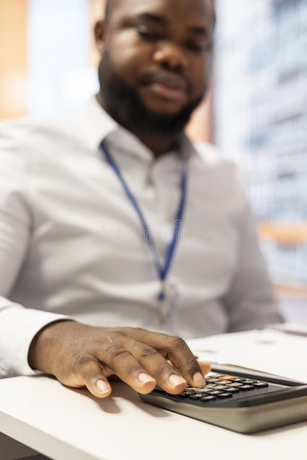 Financial specialist using calculator to create a projection for retired people royalty free stock photo
