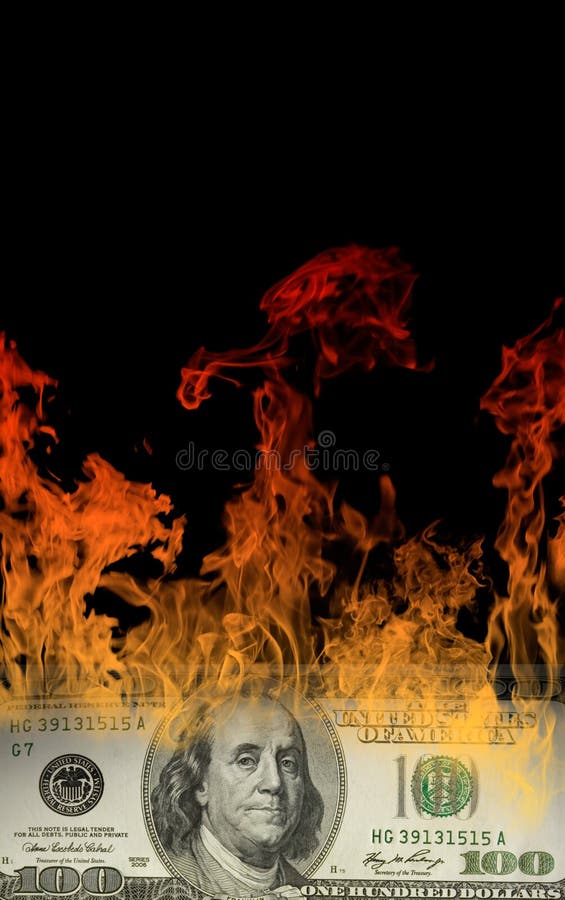 The hundred - dollar denomination burns (on a black background). Big fire. The hundred - dollar denomination burns (on a black background). Big fire.