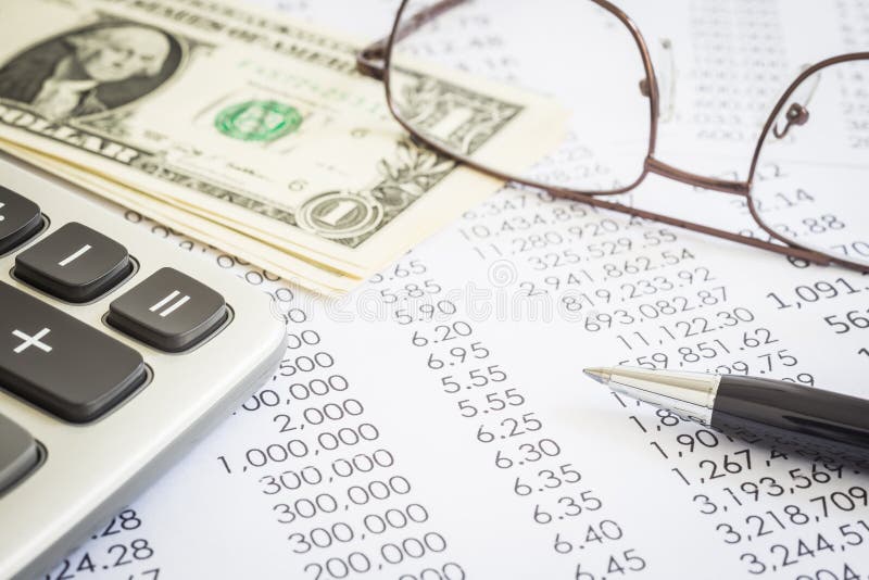 Financial statements, expend reports with modern pen, calculator, glasses and US money dollar. Concepts of accounting, audit , tax planning and marketing budget management. Financial statements, expend reports with modern pen, calculator, glasses and US money dollar. Concepts of accounting, audit , tax planning and marketing budget management.