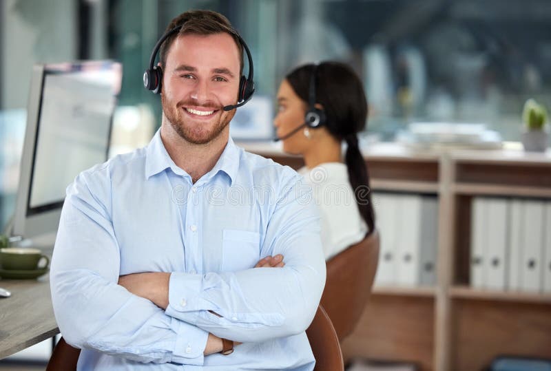 Finding answers is what were best at. Portrait of a confident young man using a headset in a modern office with his stock image
