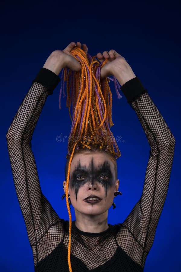 Dramatic portrait of young female with spooky stage makeup painted on face  and dreadlocks hairstyle 32500542 Stock Photo at Vecteezy