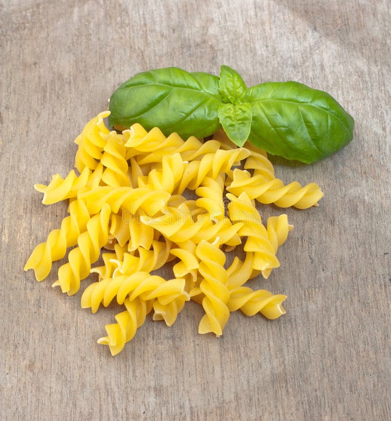 Fusilli Noodles Background, Macaroni Texture. Uncooked Gluten Free