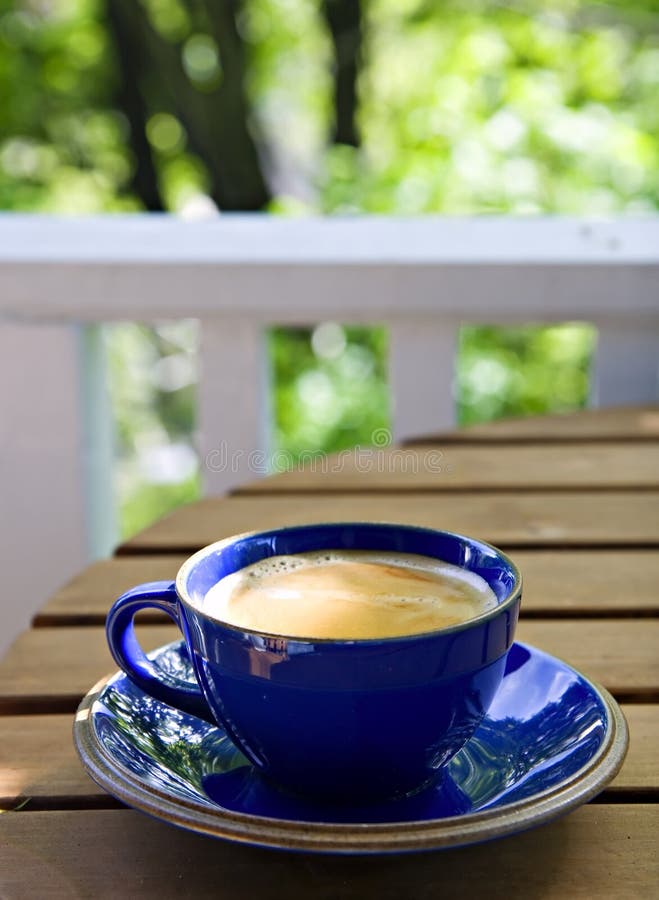 Fresh cup of coffee on a rustic table, for a feeling of a weekend morning in the countryside. Fresh cup of coffee on a rustic table, for a feeling of a weekend morning in the countryside