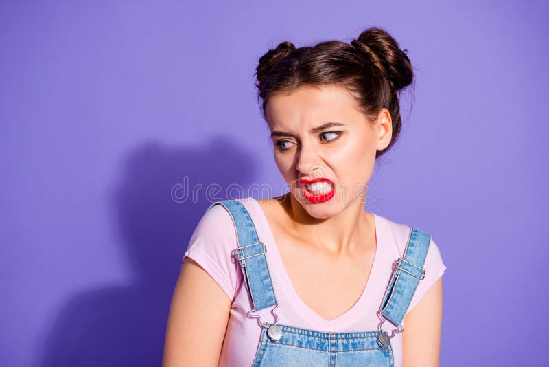 Close up photo beautiful amazing she her lady two hair buns ugh facial expression look disgusted side empty space wear casual t-shirt jeans denim overalls clothes isolated purple violet background. Close up photo beautiful amazing she her lady two hair buns ugh facial expression look disgusted side empty space wear casual t-shirt jeans denim overalls clothes isolated purple violet background.