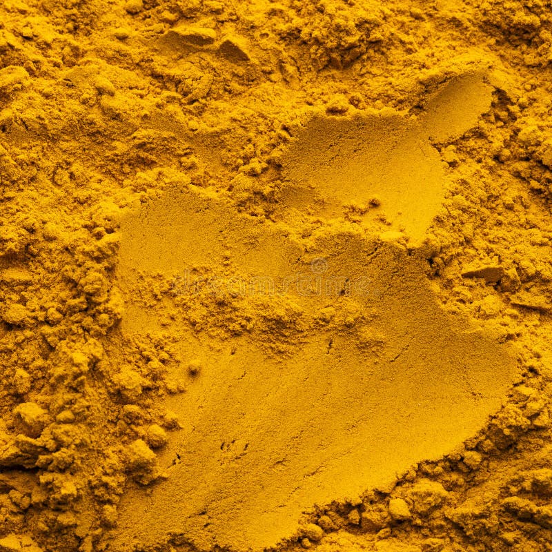 Finely dried turmeric powder scattered - Curcuma longa royalty free stock photo