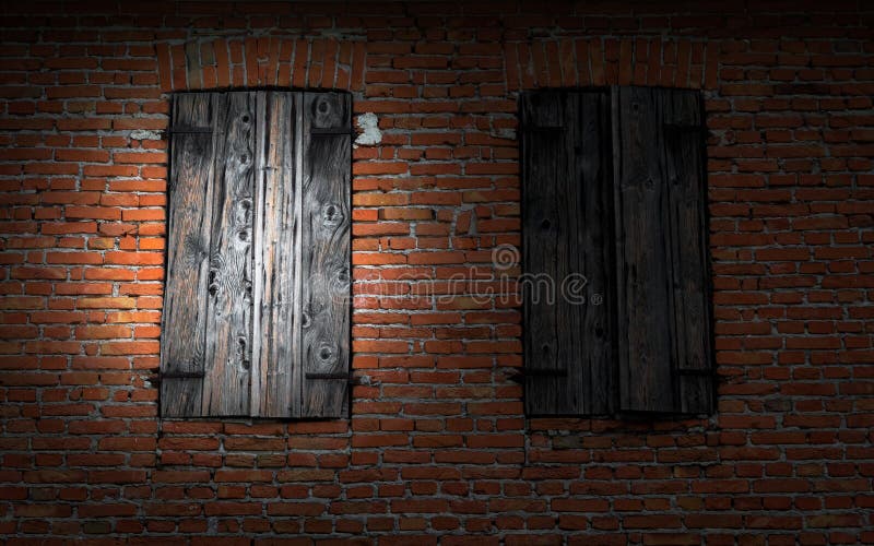 Finestra sul muro di mattoni illuminato da una torcia elettrica immagine stock Finestra sul muro di mattoni illuminato da una torcia elettrica immagine stock