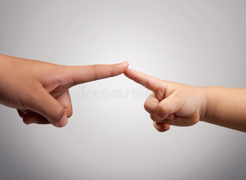 Finger of child and adult Connection