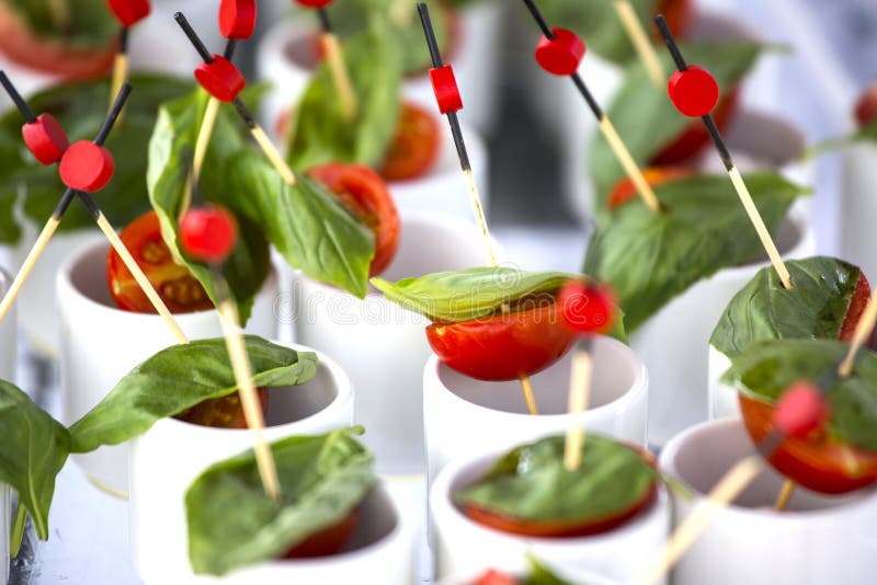 Finger Food Cherry Tomatoes, Mozzarella and Basil. Wedding Star Stock