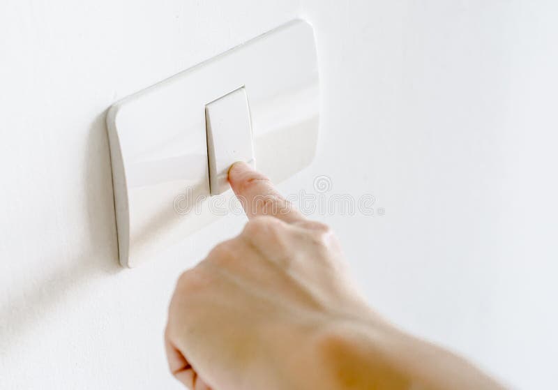 Finger press on light button royalty free stock photo